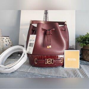 Michael Kors- NWT- Medium Oxblood Belted Bucket Messenger Bag. $175